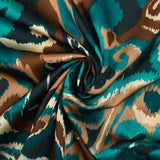 Polyester satin printed with brown and duck blue cashmere vibes