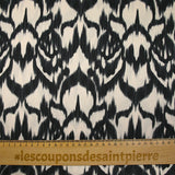Black ikat printed polyester satin with ecru background