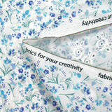 Broderie anglaise imprimée petites fleurs bleu fond blanc