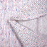 Fine sequined cotton binding of pink and blue hands on white background