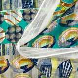 Printed muslin with turquoise and sea green sea pebble satin band