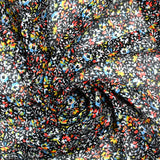 Crinkle chiffon printed iridescent crumb of flower black background