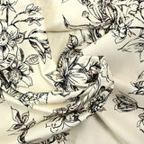 Coton imprimé crayonné de fleurs fond blanc cassé