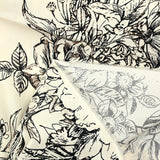 Coton imprimé crayonné de fleurs fond blanc cassé