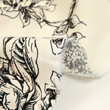 Coton imprimé crayonné de fleurs fond blanc cassé