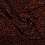 Mousseline de polyester imprimée léopard marron et noir