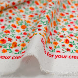 Viscose imprimée jardin secret rouge et orange fond blanc