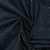 Cotton printed with mini polka dots on a midnight blue background