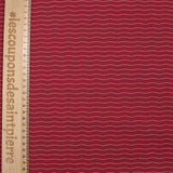 Cotton jersey printed wavy stripe burgundy background