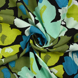 Crépon de viscose imprimé éclat de fleurs pétrole et anis fond noir
