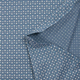Cotton jersey printed circles and half-moons cart blue background