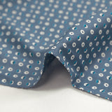 Cotton jersey printed circles and half-moons cart blue background