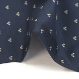 Cotton jersey printed trio of polka dots on navy background