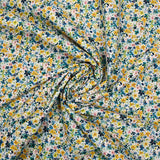 Voile de coton imprimé digital petites fleurs aquarelle jaune et bleu sur fond blanc