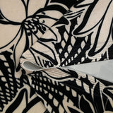 Short velvet jersey printed with ivory flowers and black background