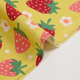 Cotton poplin printed with wild strawberries on anise background