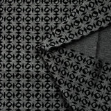 Maille Milano polyester géométrique floqué velours noir fond gris anthracite