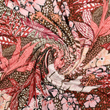 Jersey de polyester floqué et imprimé feuillage rose fond marron