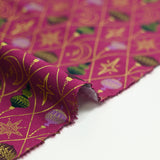 Cotton poplin printed with gold diamonds, moons and stars on a purple background