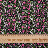 Digital printed cotton voile meadow of small fuchsia and apple green flowers on a black background