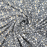 Viscose imprimée fleurs blanches et jaunes fond gris anthracite