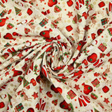 Cotton poplin printed with reindeer, snowmen and gifts on an ecru background
