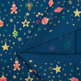 Cotton poplin printed gingerbread men and glittered stars blue background