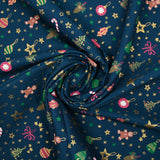 Cotton poplin printed gingerbread men and glittered stars blue background