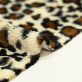 Fondo beige de piel de leopardo sintética