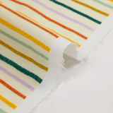 Algodón estampado de rayas multicolor con fondo crudo