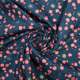 Cotton poplin printed with coral roses and gold flakes on a steel blue background