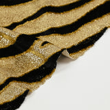 Lamé et velours viscose tigre noir fond doré