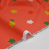 Tortugas de algodón estampado de fondo naranja