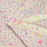Tweed de laine mélangée confettis rose et bleu fond violet