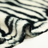 Faux fur zebra white background