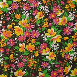 Coton imprimé vent floral orange et fuchsia fond marron