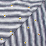 Coton tissé teint brodé marguerite fond rayé blanc et marine