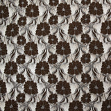Dentelle polyester Martha métallisé argent fond marron
