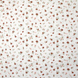 Jersey pointelle coton imprimé envolée de fleurs rose et brique fond blanc cassé