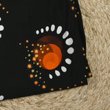 Maille de viscose satinée imprimée éclipse orange fond noir