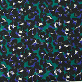 Mousseline crinkle imprimée léopard noir et violet fond vert