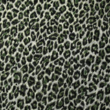 Mousseline imprimée plumetis velours léopard vert fond blanc