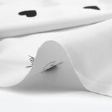 Cotton Poplin estampado Corazón negro Fondo blanco