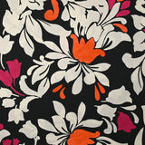 Satin de viscose fin imprimé fleurs royales fuchsia, orange et écru fond noir