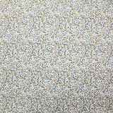 Voile de coton imprimé digital fleurettes bleues et feuillage vert sur fond écru