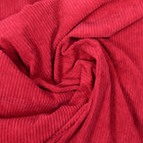 Raspberry ribbed polyester velvet