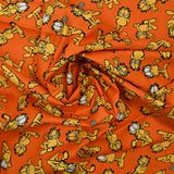 Popeline de coton imprimé Garfield fond orange