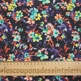Algodón estampado floral gráfico fondo naranja y morado negro