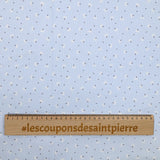 Piqué de coton imprimé pissenlit fond bleu clair