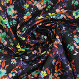 Algodón estampado floral gráfico fondo naranja y morado negro